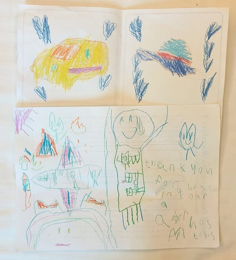 Children’s hand-drawn thank you cards created for flight attendants, featuring colourful planes, smiling figures, and a note of appreciation