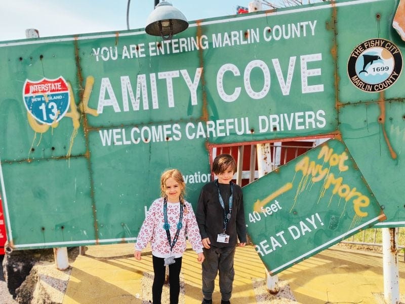 Two Kids (Philip and Lillia), stood in front of one of the signs at thorpe park