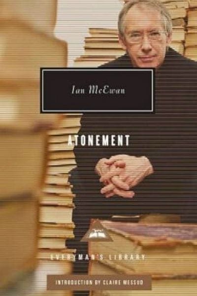 Book cover of Atonement by Ian McEwan, featuring the author seated with hands clasped in front of stacks of books, part of the Everyman’s Library edition.