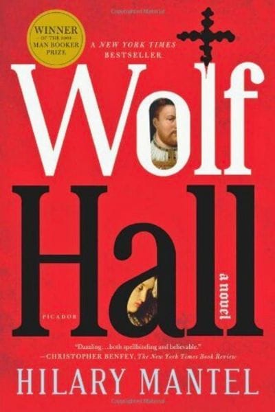 Book cover of Wolf Hall by Hilary Mantel, featuring bold red background, black typography, a Tudor cross, and portraits of Thomas Cromwell and Anne Boleyn