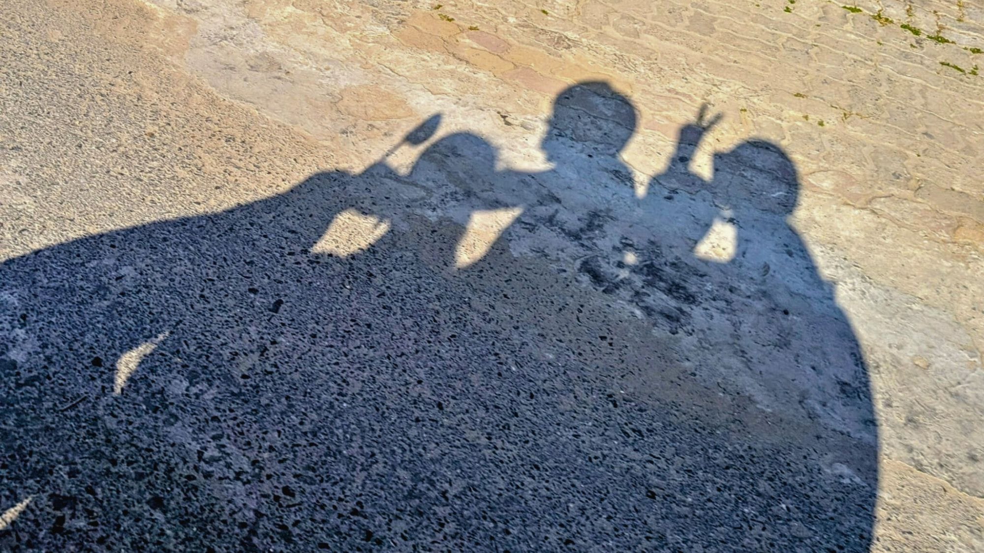 Shadow of a family of four on the ground during a sunny day in Phu Quoc
