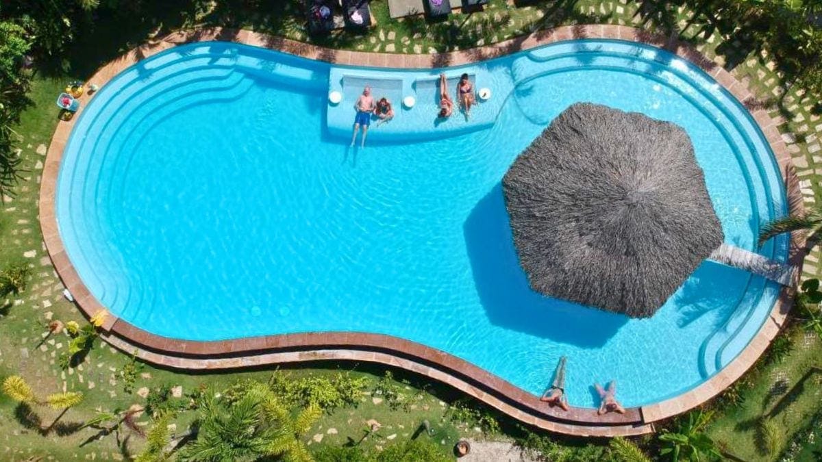Aerial view of the family swimming pool at La Forest Resort in Phu Quoc surrounded by tropical gardens